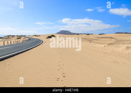 Road in desert landscape of sand dunes in Corralejo National Park, Fuerteventura, Canary Islands, Spain Stock Photo
