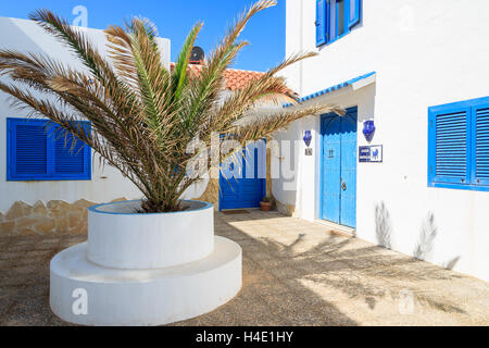 CORRALEJO, FUERTEVENTURA - FEB 5: typical holiday villa house with green window shutters and white walls in Corralejo town on 5th Feb 2014, Canary Islands, Spain Stock Photo