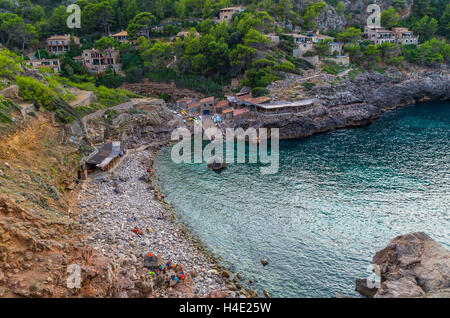 Beach Cala Deia at coast of Mallorca in Tramuntana mountains, Baleares, Spain Stock Photo