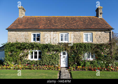 House with flowerbed, Newtown, Isle of Wight, UK Stock Photo