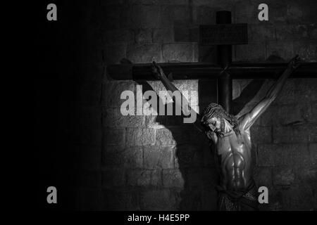 Old medieval crucifix in Italian church - made of wood Stock Photo