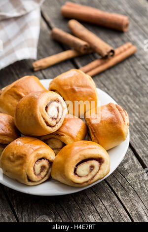 Mini cinnamon buns on plate. Stock Photo