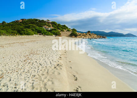 Footprints on Porto Giunco sandy beach and turquoise sea view, Sardinia island, Italy Stock Photo