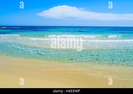 Waves on sandy Cala Sinzias beach and turquoise sea, Sardinia island, Italy Stock Photo
