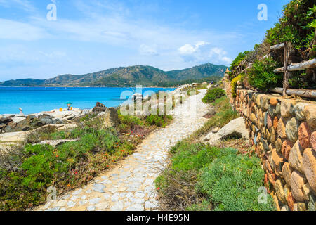 Walking path on coast of Sardinia island near Spiaggia del Riso beach, Italy Stock Photo