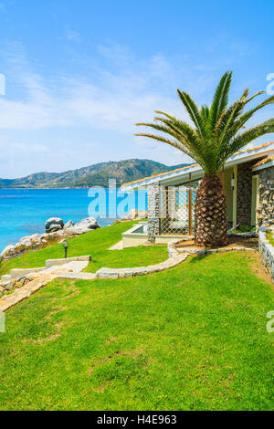 Beautiful holiday villa house on coast of Sardinia island - view from promenade at Spiaggia del Riso beach, Italy Stock Photo