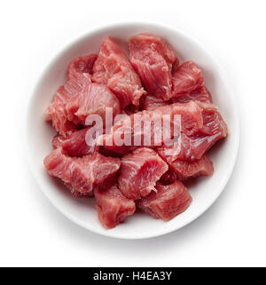 White bowl of raw diced beef meat isolated on white background, top view Stock Photo