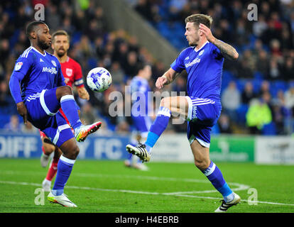 Cardiff City's Junior Hoilett (left) and Joe Ralls in action during the Sky Bet Championship match at The Cardiff City Stadium. PRESS ASSOCIATION Photo. Picture date: Friday October 14, 2016. See PA story SOCCER Cardiff. Photo credit should read: Simon Galloway/PA Wire. RESTRICTIONS: No use with unauthorised audio, video, data, fixture lists, club/league logos or 'live' services. Online in-match use limited to 75 images, no video emulation. No use in betting, games or single club/league/player publications. Stock Photo