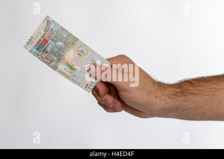 Kuwaiti dinar banknote in hand. Kuwaiti dinar is the ...