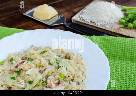 Italien risotto with mushrooms and spring onion Stock Photo