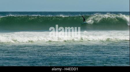 Lone surfer riding a classic wave at Surfrider Beach in Malibu, California. (USA) Stock Photo