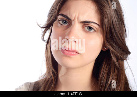 Portrait of young serious and angry woman. Isolated white background. Stock Photo