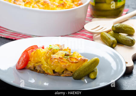 Baked Pasta with pork meat and fresh vegetable and delicious pickes Stock Photo