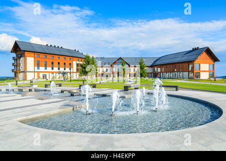ARLAMOW HOTEL, POLAND - AUG 3, 2014: water fountain in beautiful Arlamow Hotel on sunny summer day. This luxury resort was owned by Poland's government and is located in Bieszczady Mountains. Stock Photo