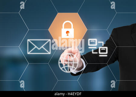 Business man pressing security button on virtual screens. Business, technology and internet concept Stock Photo