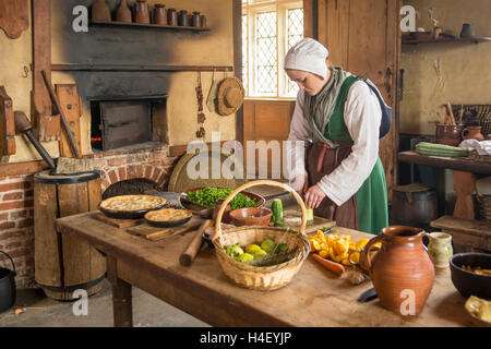 Tudor Kitchen Wench in Kentwell Hall, Long Melford, Suffolk, England Stock Photo