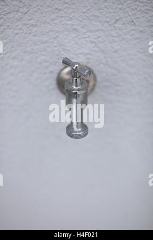 Tap on a wall Stock Photo