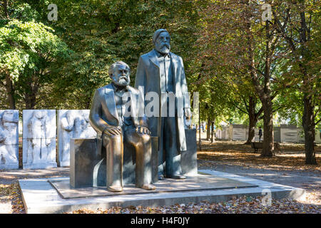 The statues of Karl Marx and Friedrich Engels in a park of Berlion Stock Photo