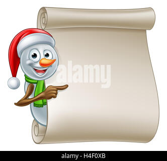 A cute cartoon Christmas snowman in Santa hat peeking around scroll sign and pointing Stock Photo