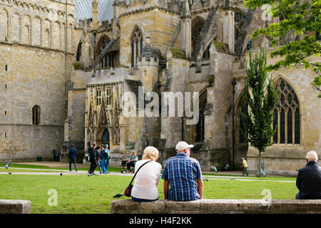 Exeter, Devon, England, UK - 30 September 2016: Two unidentified people look at Exeter Cathedral. Stock Photo