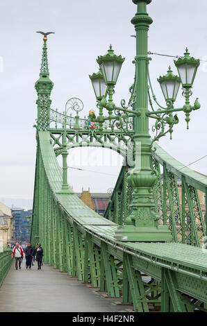 Tourists on the Liberty Bridge in Budapest, Hungary Stock Photo