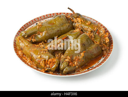 Traditional Moroccan dish with stuffed bell peppers and rice on white background Stock Photo