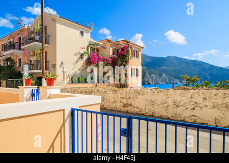 ASSOS TOWN, KEFALONIA ISLAND - SEP 18, 2014: view of typical Greek houses built in Venetian style in Assos town which is very popular tourist destination on Kefalonia island. Stock Photo