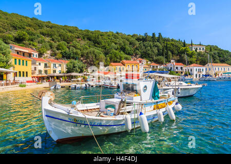 KIONI PORT, ITHAKA ISLAND - SEP 19, 2014: typical fishing boat mooring in Kioni port. Greek islands are popular holiday destination. Stock Photo