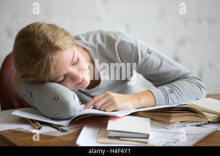 Portrait of a student girl sleeping at the desk Stock Photo