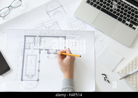 Top view of a hand making an architect drawing Stock Photo