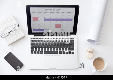 High angle view image of desk, planner calendar on laptop Stock Photo