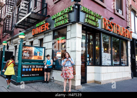 New York City,NY NYC Manhattan,West Village,Waverly Diner,restaurant restaurants food dining cafe,dining,neon sign,exterior,open 24 hours,Black,adult, Stock Photo