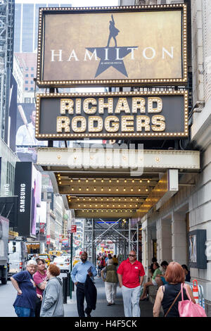 New York City,NY NYC Manhattan,Midtown,Broadway,theater district,Hamilton,Richard Rodgers Theatre,musical,marquee,front,entrance,adult adults,woman fe Stock Photo