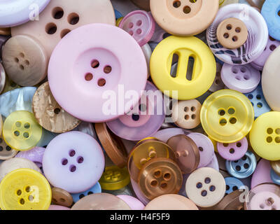 Pile of apparel buttons in different size and colors shot from above Stock Photo