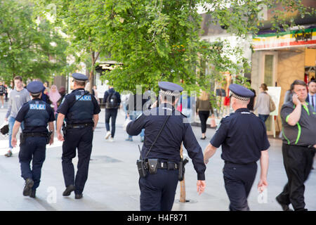 Australian Police officers walking through Adelaide city centre in South Australia Stock Photo