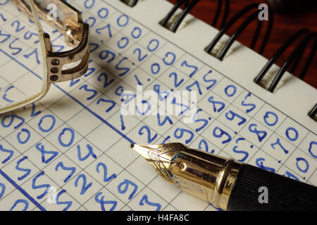 Open ledger book with figures. Bookkeeping concept. Stock Photo
