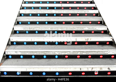 No entry stickers on stair risers of uk railway station platform staircase to indicate correct up & down access those coming down see nothing Stock Photo