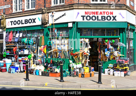 English hardware homeware shop with large quantity of stock hanging from shop front window and placed on pavement in Nuneaton West Midlands England UK Stock Photo