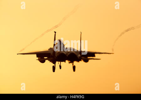 F-15E Strike Eagle United States air Force landing at RAF Lakenheath Suffolk UK at sunset Stock Photo