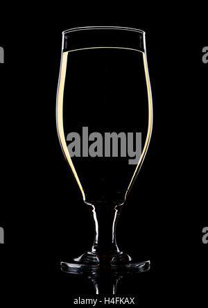 Glass of beer cider with yellow lines on black background Stock Photo