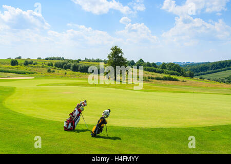PACZULTOWICE GOLF CLUB, POLAND - AUG 9, 2014: golf course green play area in Paczultowice village on sunny summer day, Poland. Golfing is becoming a popular sport among wealthy people from Krakow. Stock Photo