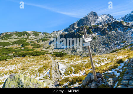 Direction sign on mountain trail to Koscielec mountain, High Tatras, Poland Stock Photo