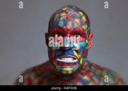 Furious villain portrait, colorful face art with tilt shift and motion blur effect. Stock Photo