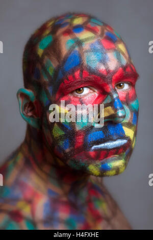 Serious villain portrait, colorful face art with tilt shift and motion blur effect. Stock Photo
