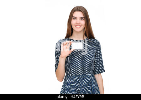 Portrait of young smiling business woman holding blank card Stock Photo