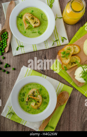 Spring peas soup, beautiful composition, 2 soups, one focus, juice and fennel Stock Photo