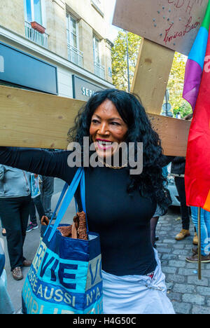 Paris, France, French Woman, LGBT Activism, Marching in Annual Trans Demonstration, Existrans, trans rights protest, Woman holding protest signs Stock Photo