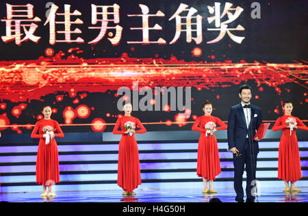 Changchun, China's Jilin Province. 15th Oct, 2016. Actor Huang Xiaoming, winner for Best Actor, attends the closing ceremony of the Changchun Film Festival in Changchun, northeast China's Jilin Province, Oct. 15, 2016. The film festival closed here Saturday. Chinese film stars Huang Xiaoming and Bai Baihe won the festival's best actor and actress' awards. Hong Kong film director Derek Tung-Shing Yee was honored the best director's award. The best Chinese language film award was conferred to 'Xuan Zang'. © Xu Chang/Xinhua/Alamy Live News Stock Photo
