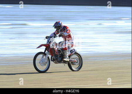 Weymouth, Dorset, UK.  16th October 2016. Competitors on their bikes testing themselves on the demanding circuit  of the Weymouth Lions Beach Motocross.  Photo by Graham Hunt/Alamy Live News Stock Photo