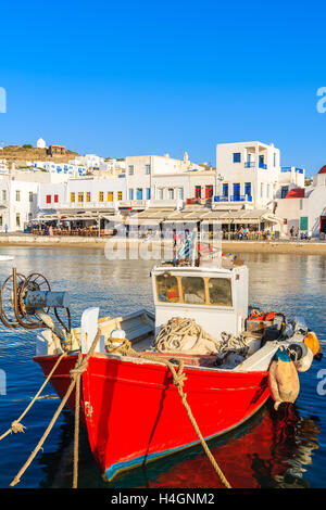 Traditional red fishing boat in Mykonos port, Greece Stock Photo